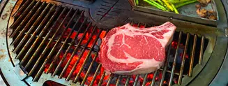 Cooking a raw steak on a gather grill