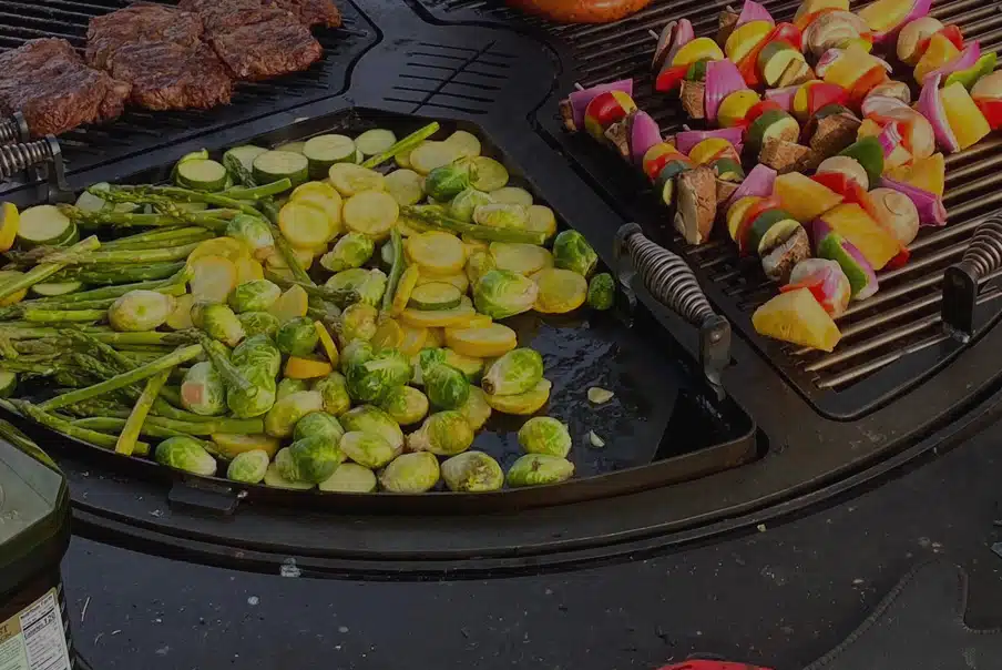 Cooking Brussels sprouts zucchini and asparagus on the gather grill.